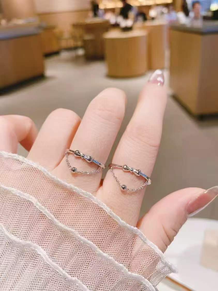 Dancing Silhouette Ring | Hand-Sculpted Bow & Dangling Bead | 925 Sterling Silver Heirloom