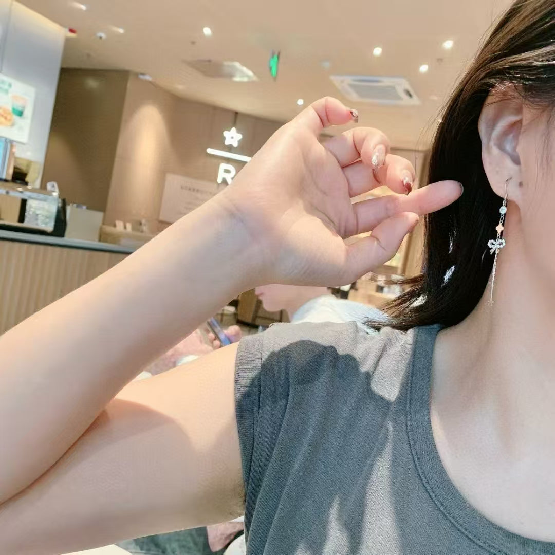 Boucles d'oreilles nœud enchanté en argent sterling 925 : une féminité intemporelle avec une touche scintillante