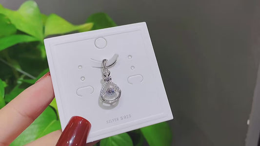 Collier pendentif « Cœur battant » en argent sterling 925 et zircone mobile – Une symphonie de lumière et de mouvement