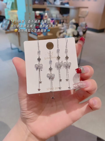 Boucles d'oreilles nœud enchanté en argent sterling 925 : une féminité intemporelle avec une touche scintillante